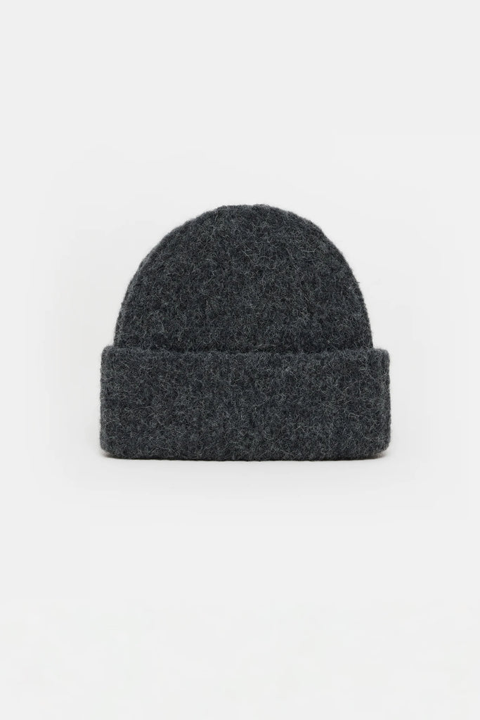 Dark gray beanie on a light gray background