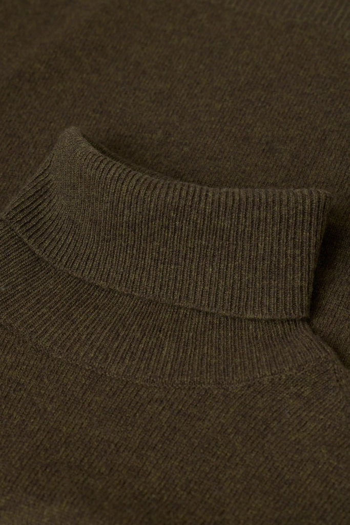 Close-up of a brown sweater with a ribbed collar.