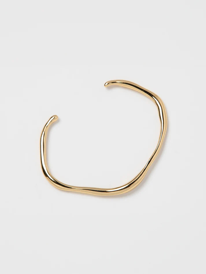 Gold neck ring on a white background