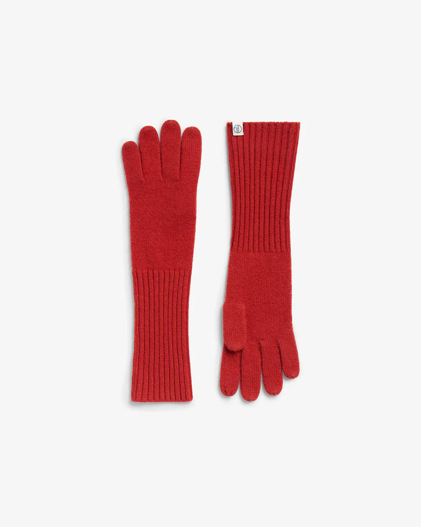 Pair of red gloves on a white background